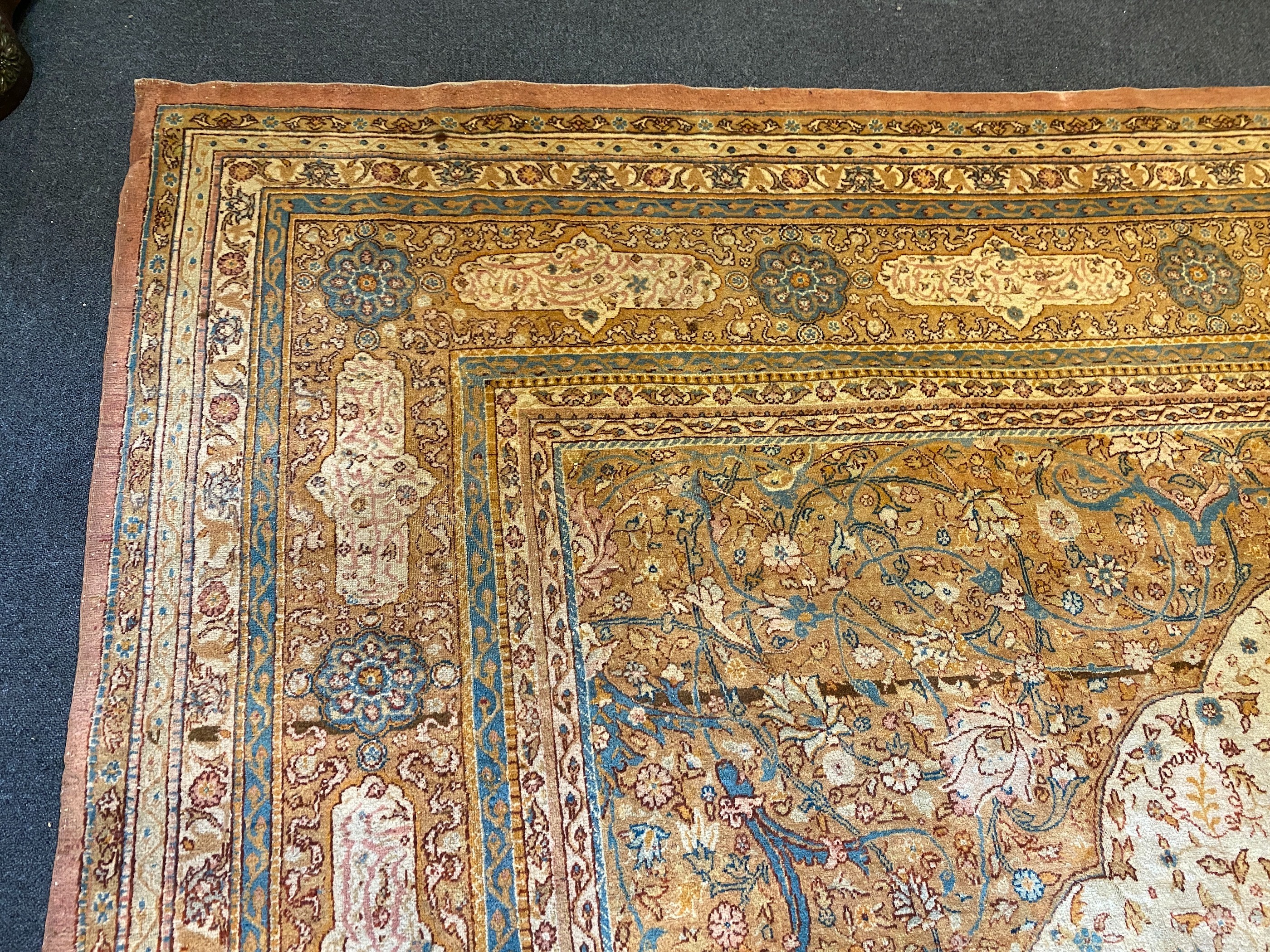 An early 20th century Tabriz ivory ground carpet, 528 x 348cm